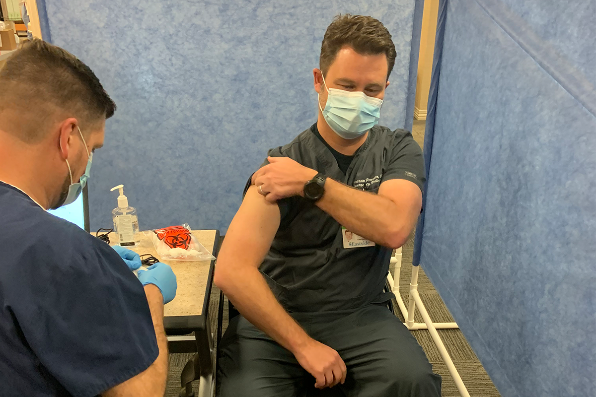 Dr. Bertram Prosser receives a COVID_19 vaccine